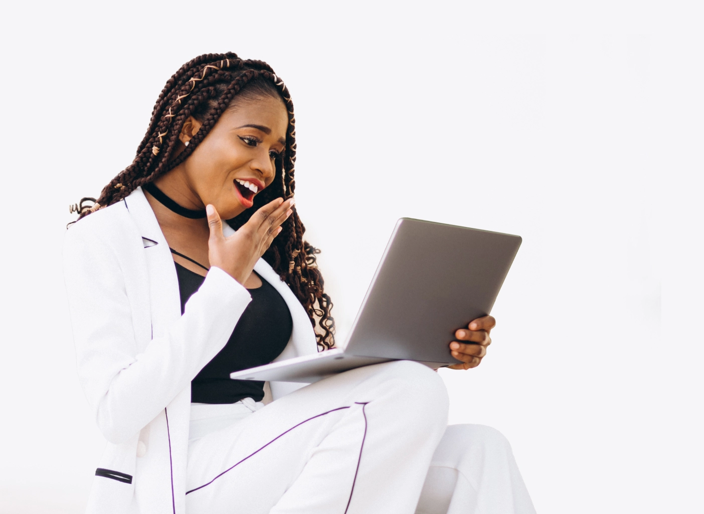 A pretty lady looking at the brand identity delivered by the creative agency on her laptop with the sense of satisfaction