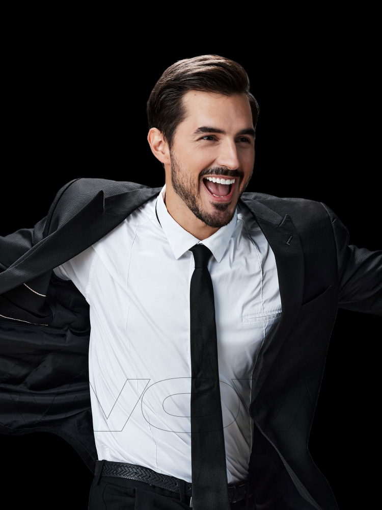 A happy business owner celebrating his brand's success, representing the results of our creative agency.